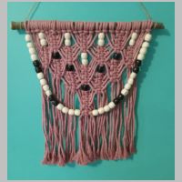 pink beaded macrame wall hanging